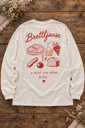 Weißes Damen Oversize-Longsleeve Brettljause – Rückenmotiv auf Altholztisch